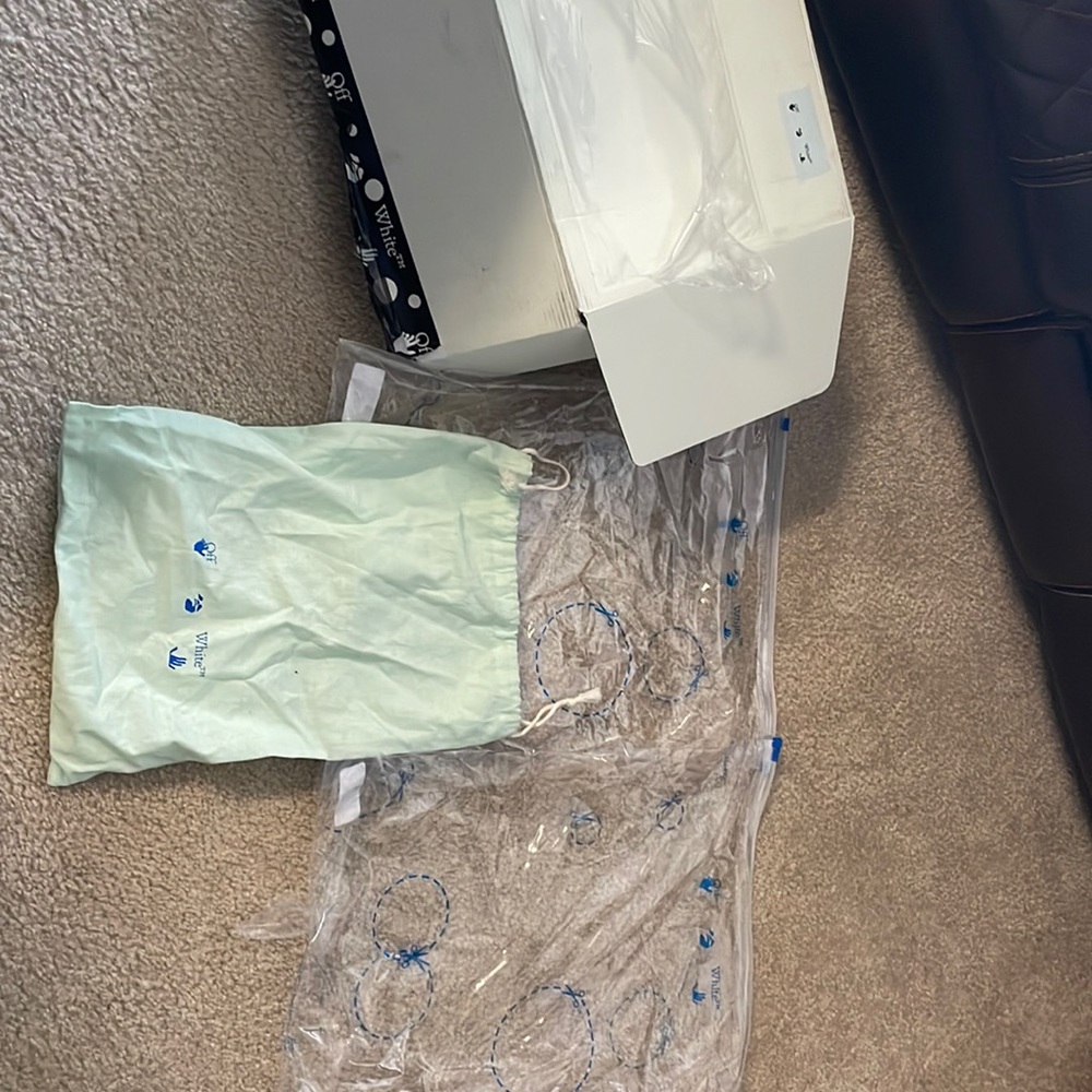 Off white box, 2 clear bags and one dust bag